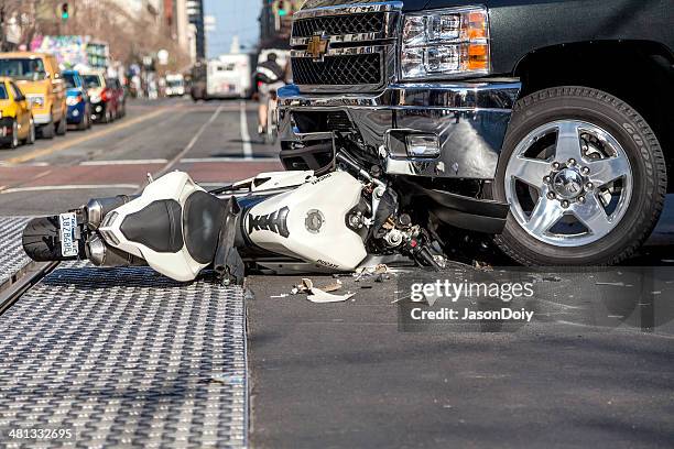 San Francisco, USA - January 23, 2014: A bad traffic accident between a white Ducati motorcycle and Chevy pickup truck occurred on Market street in the late afternoon and brought traffic to a halt, backing up Muni buses and light rain trains. No fatalities were reported.